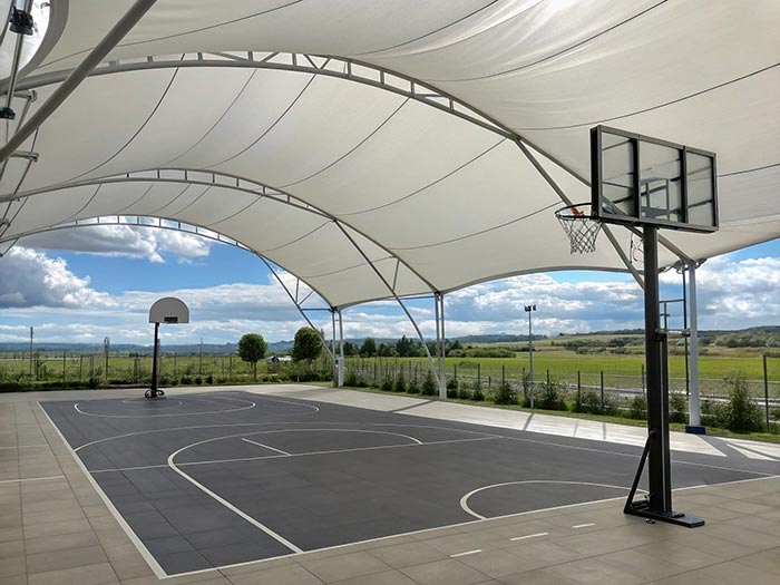Building an open basketball court with tensile fibre and structure membranes fabrics